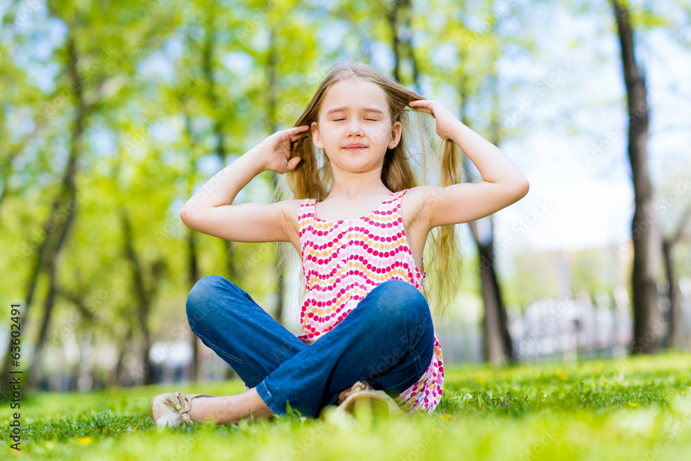 portrait of a smiling girl in a park