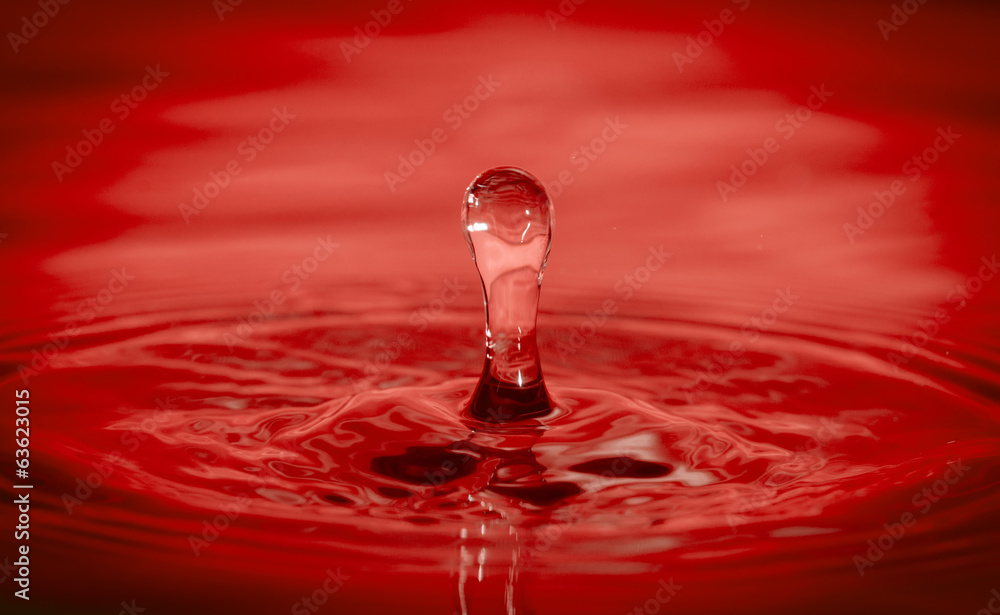 Drop of water in hot red tone