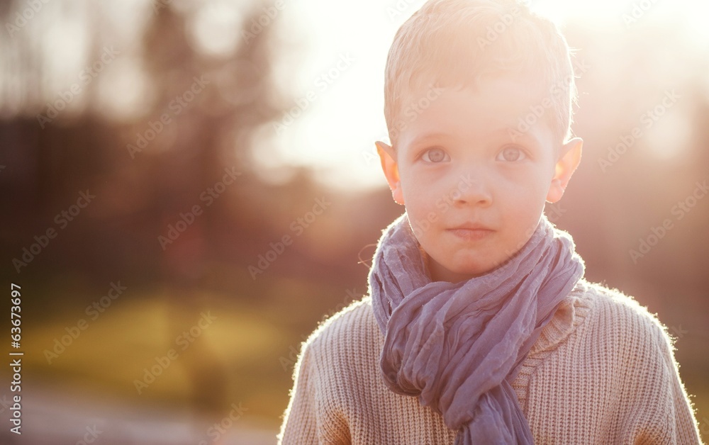 Little boy in sweater and scarf