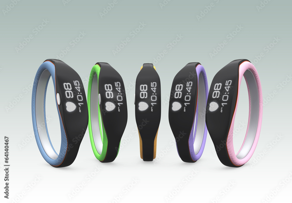 Colorful smart wristbands on gray background