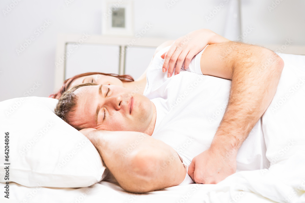 man sleeping in bed