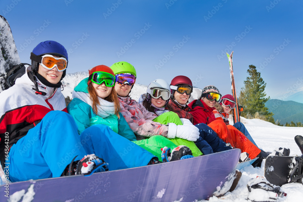 Friends with snowboards wearing ski googles