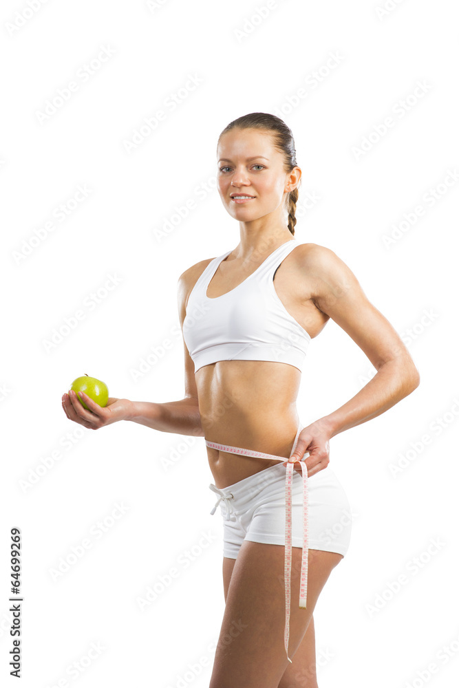 young athletic woman measuring waist