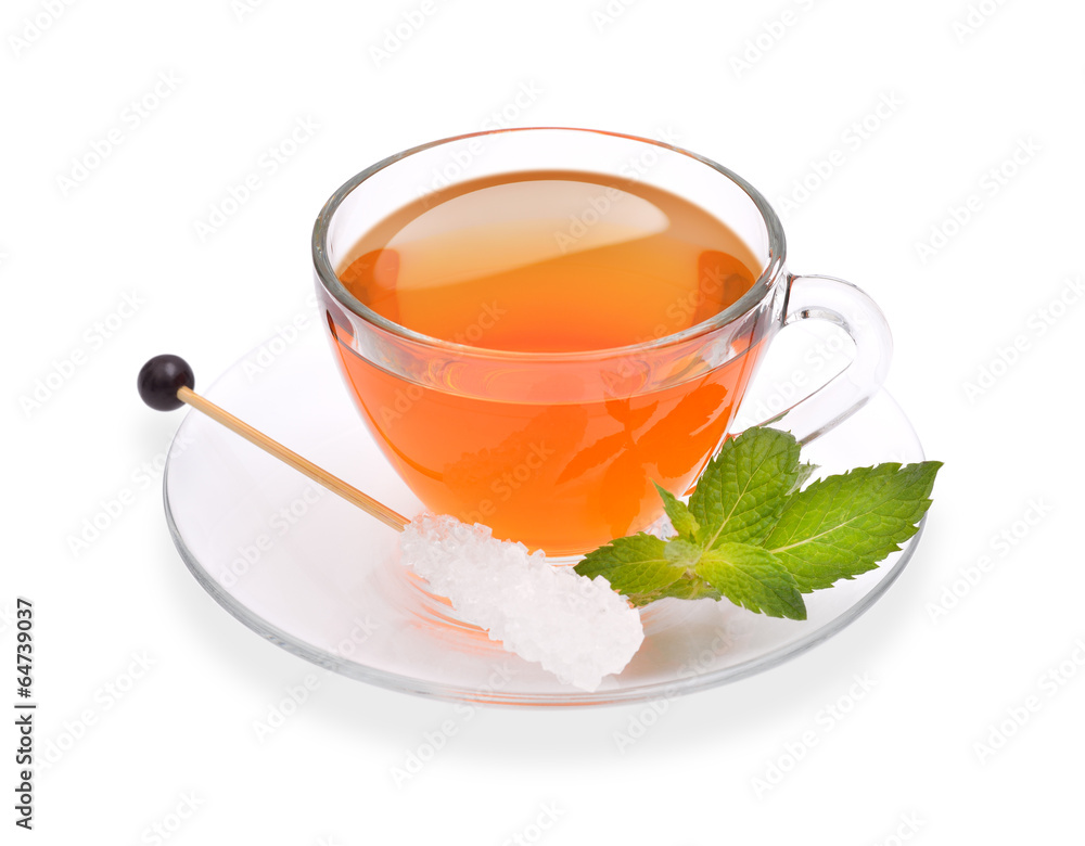 Cup of tea with mint and sugar stick isolated on white