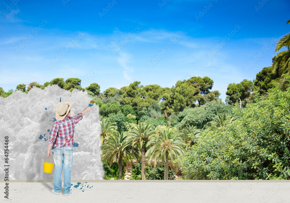 boy paints the wall