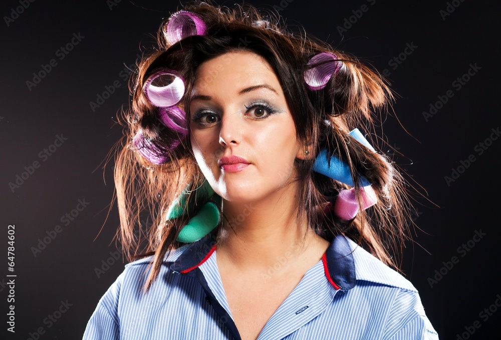 Funny woman portrait hair with curlers