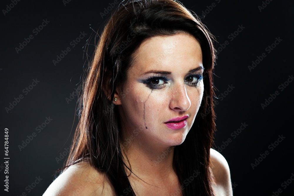 Hurt woman crying, smeared makeup