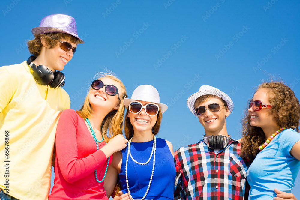 group of young people wearing sunglasses and hat