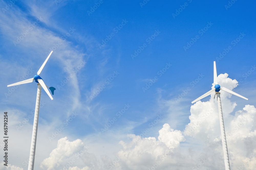 Wind mill power plant against blue sky