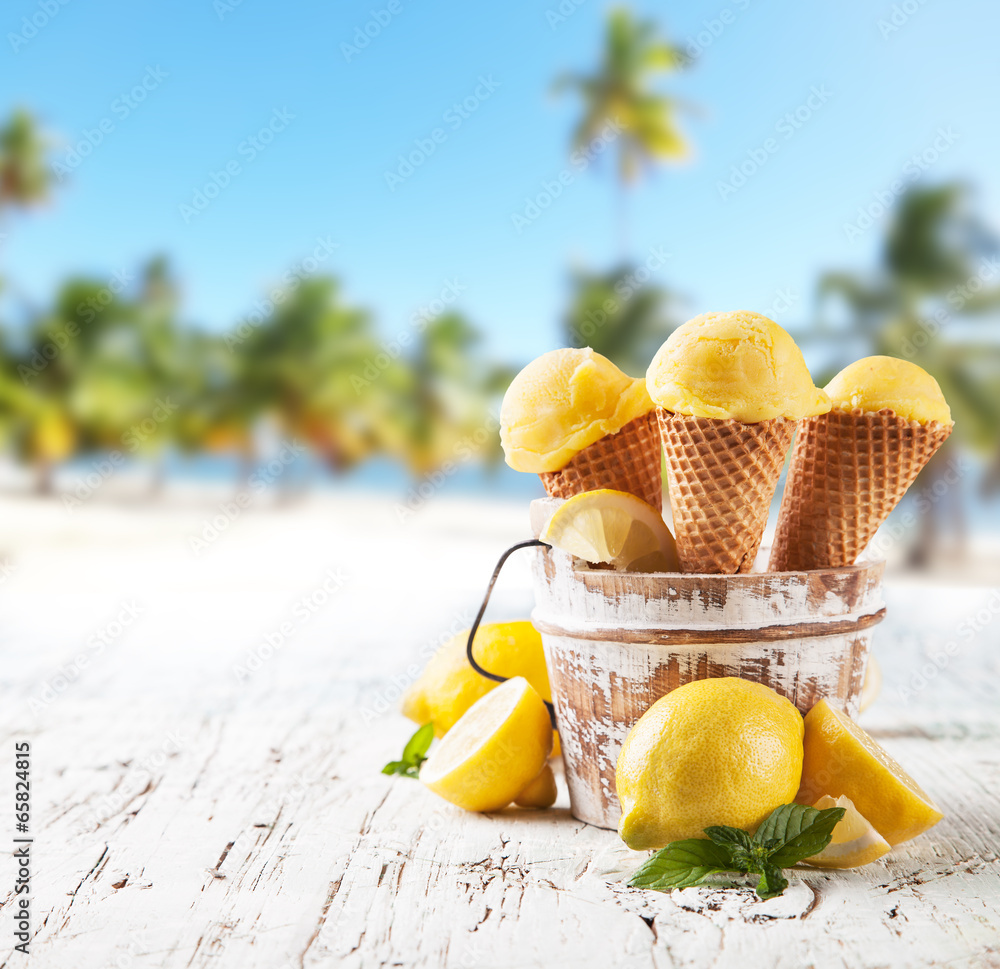 Lemon cce cream scoops in cones with blur beach