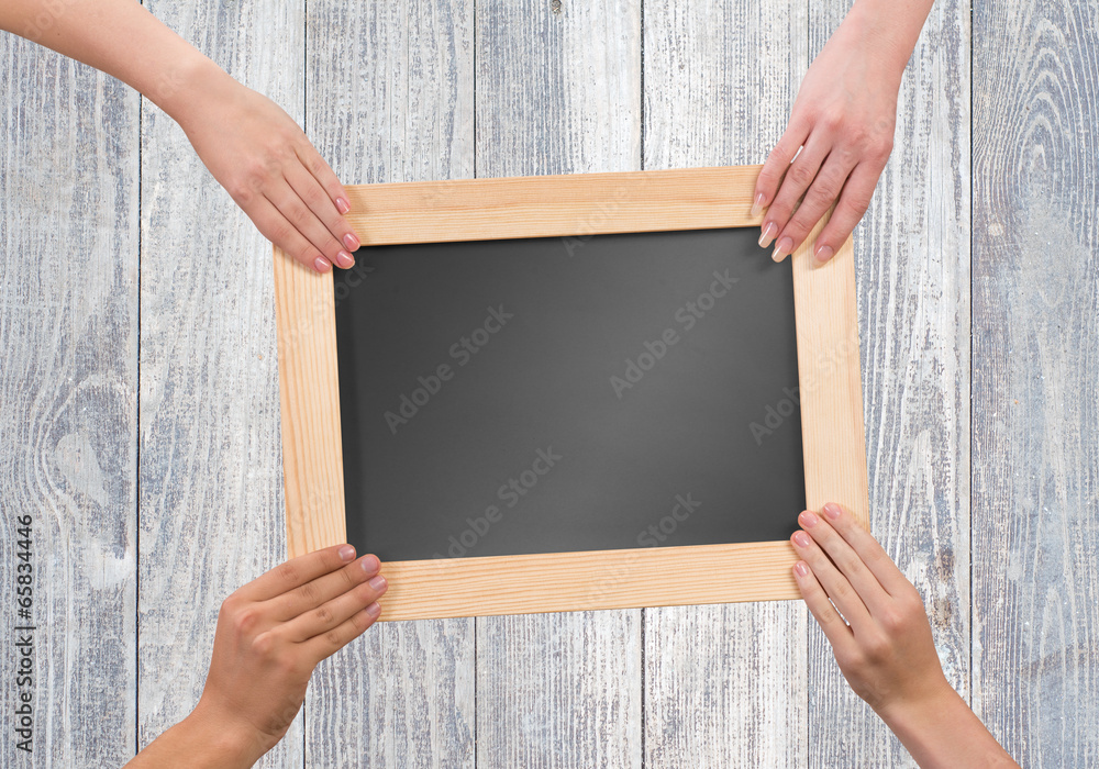 Hands holding frame