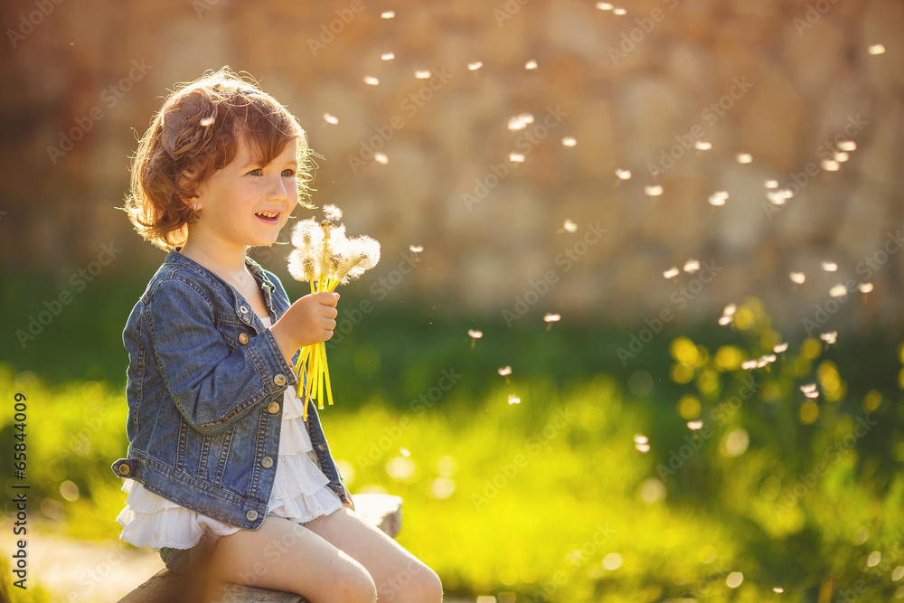 Portrait of a cute little girl on a sunny summer day