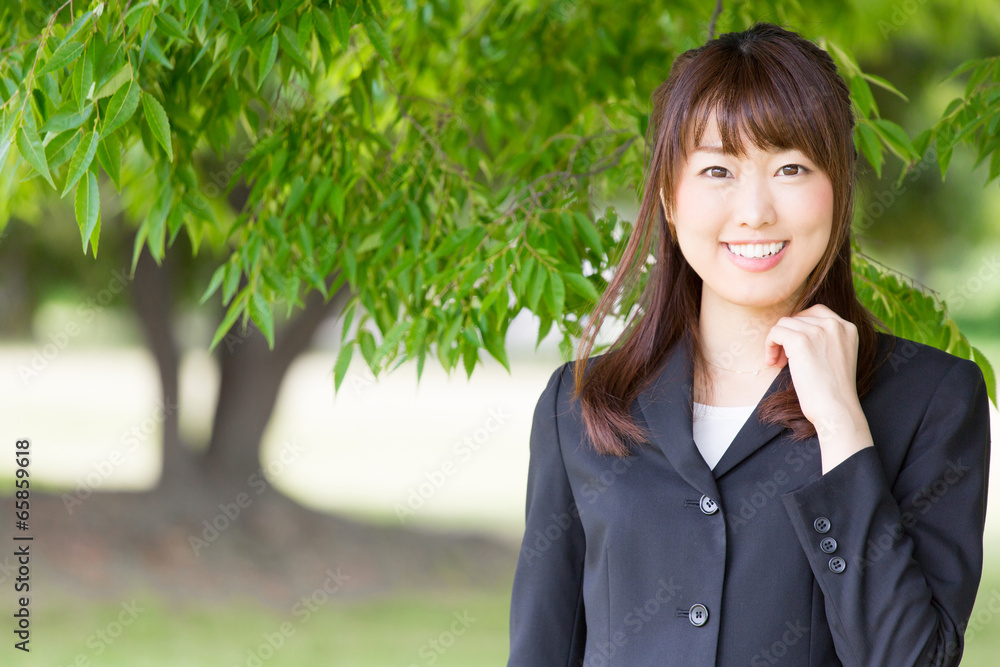 young asian woman on green background