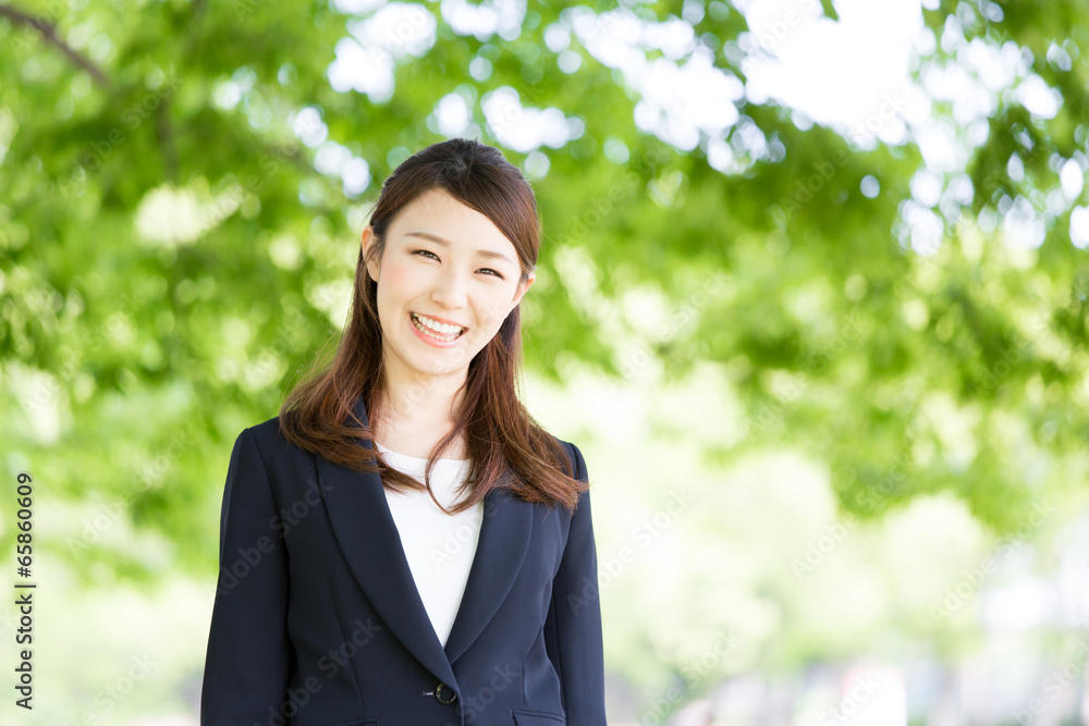 young asian woman on green background