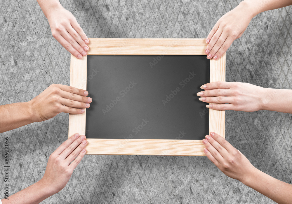 Hands holding frame