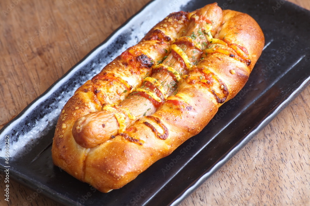 Close - up Hotdog sausage in black plate