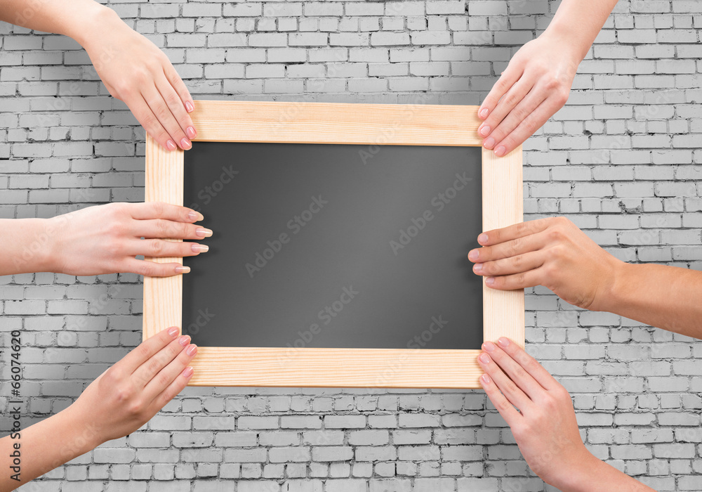 Hands holding frame