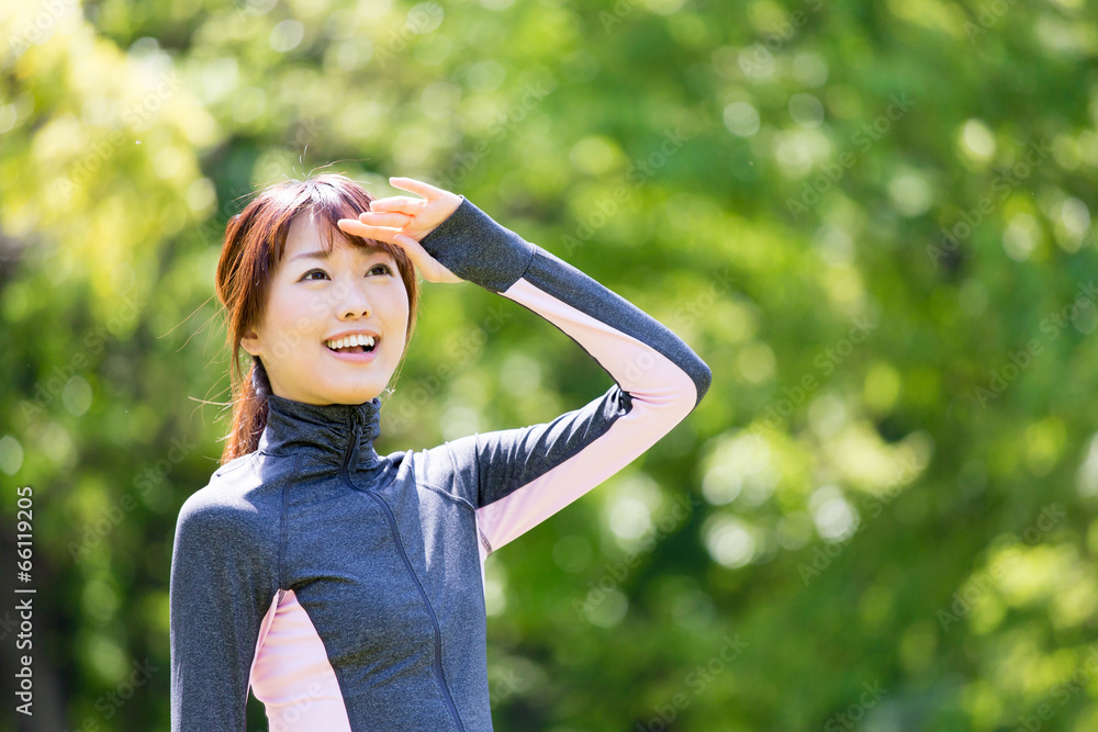 young asian woman relaxing in the park