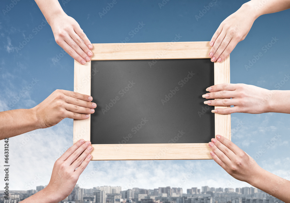 Hands holding frame