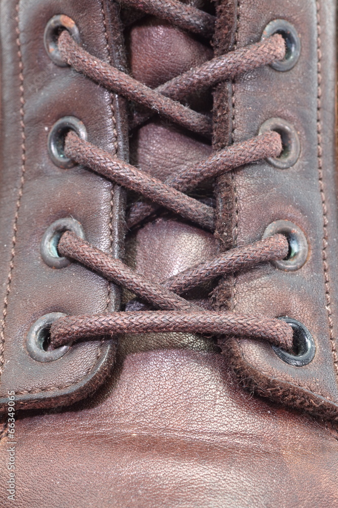 close - up men brown leather boots detail