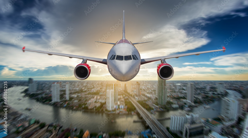 Passenger airplane landing on runway in airport