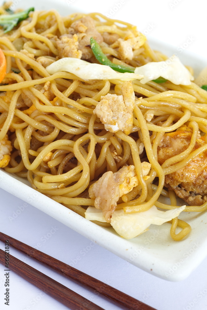 Chinese food stir - fried noodles with pork and vegetables