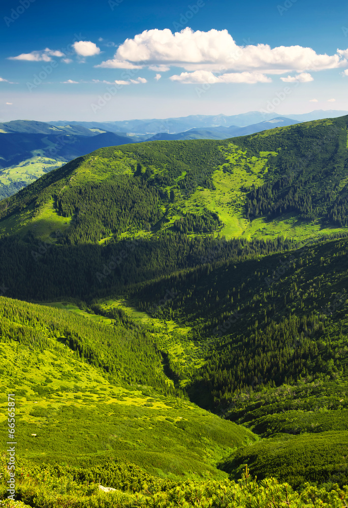 Green hills and sky with clouds. Beautiful rural landscape