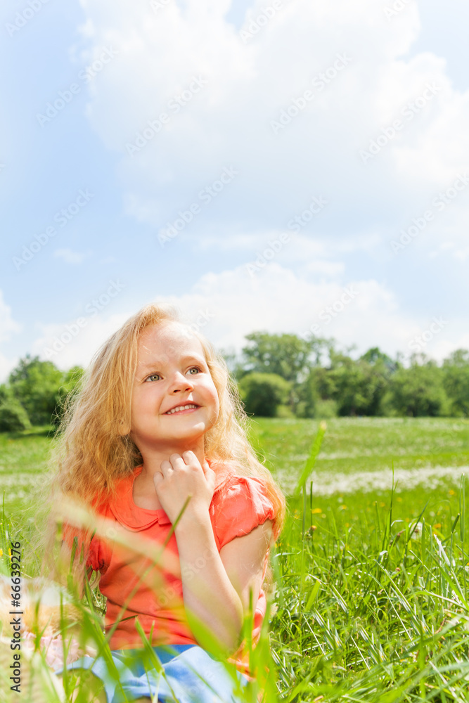 Beautiful small girls portrait in green park