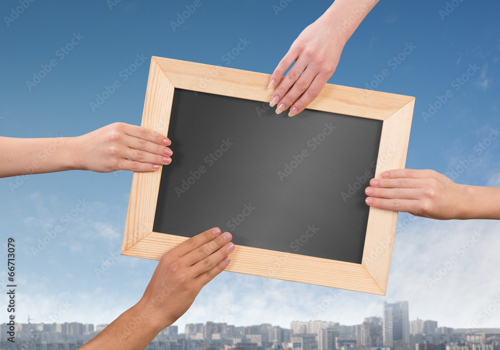 Hands holding frame