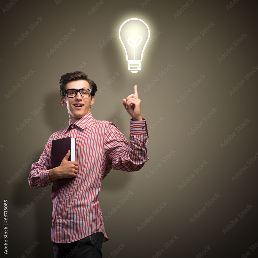 young man holding a book