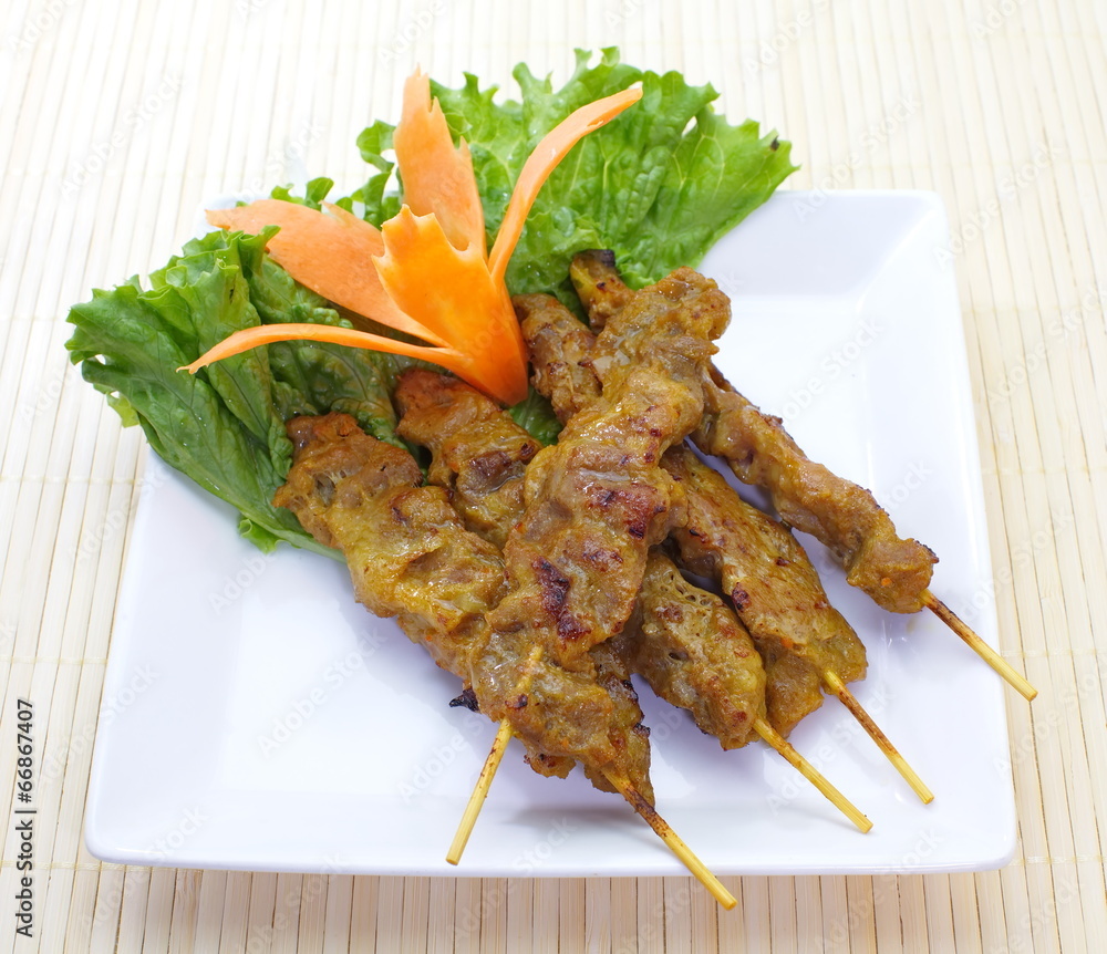 Grilled Pork Satay with fresh vegetable on white background