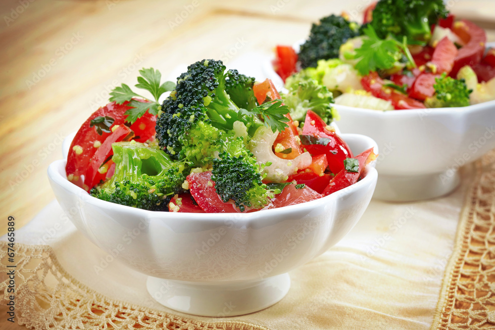 two bowls of vegetable salad