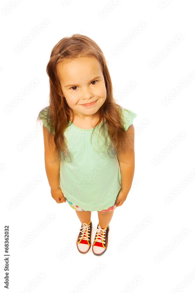 Cute girl in green shirt on a white background