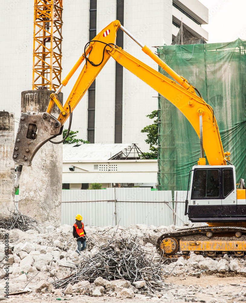 Excavator and Workers Working on Construction Site