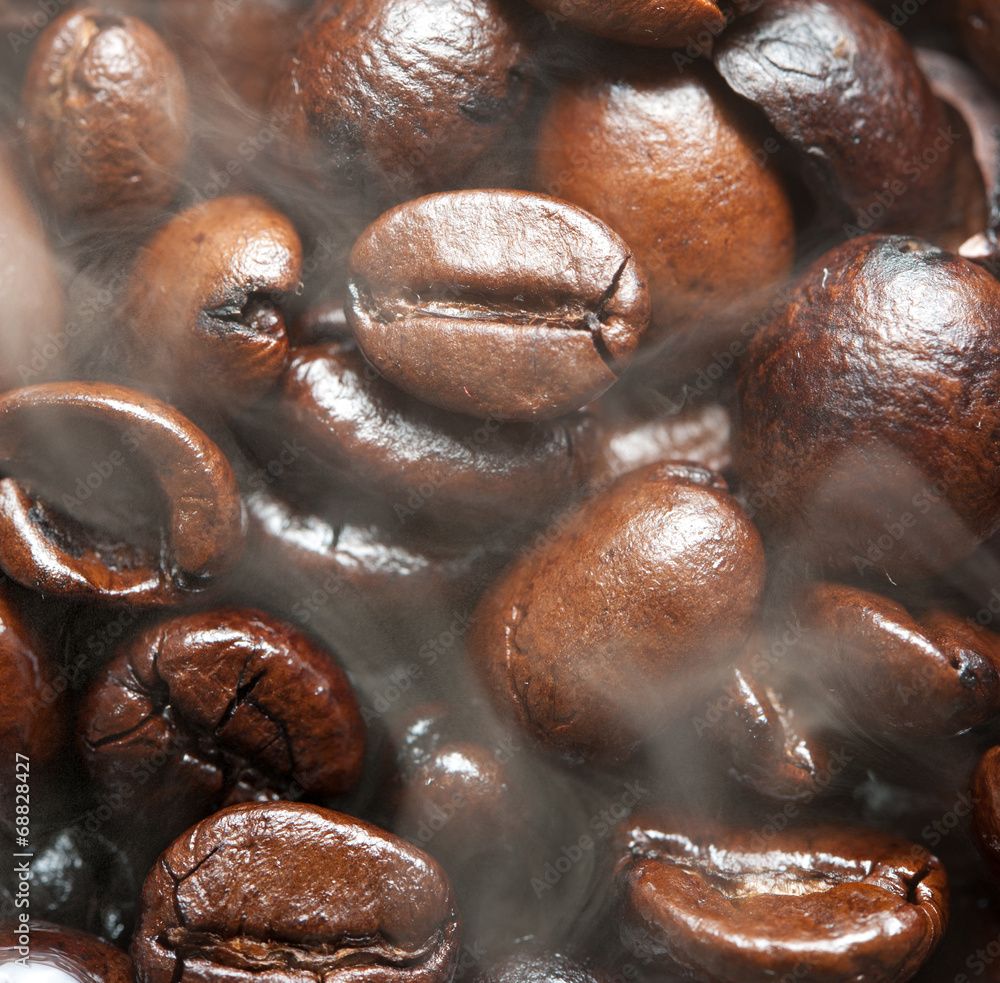 Roasted Coffee bean background with smoke on surface