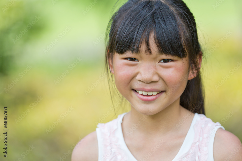 Happy Chinese girl in the park