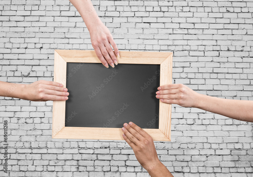 Hands holding frame