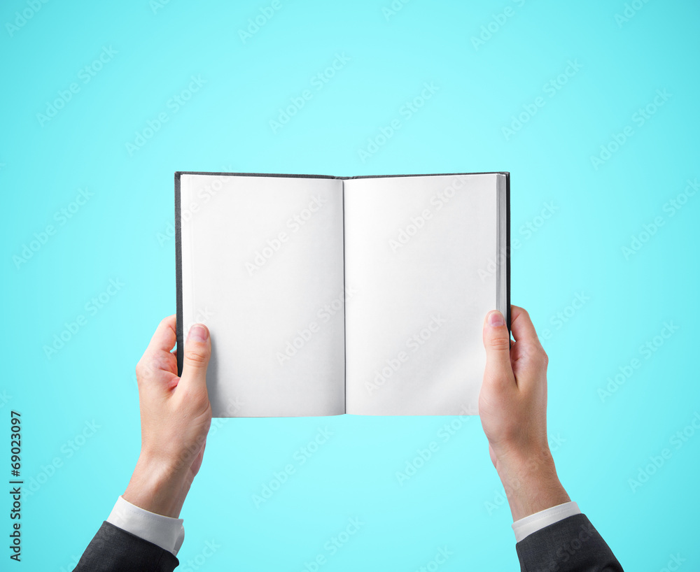 hands holding a book