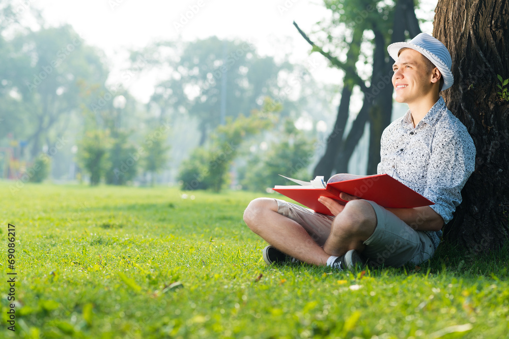 young man reading a book