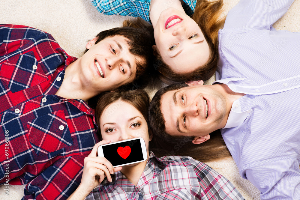 four young men lie together