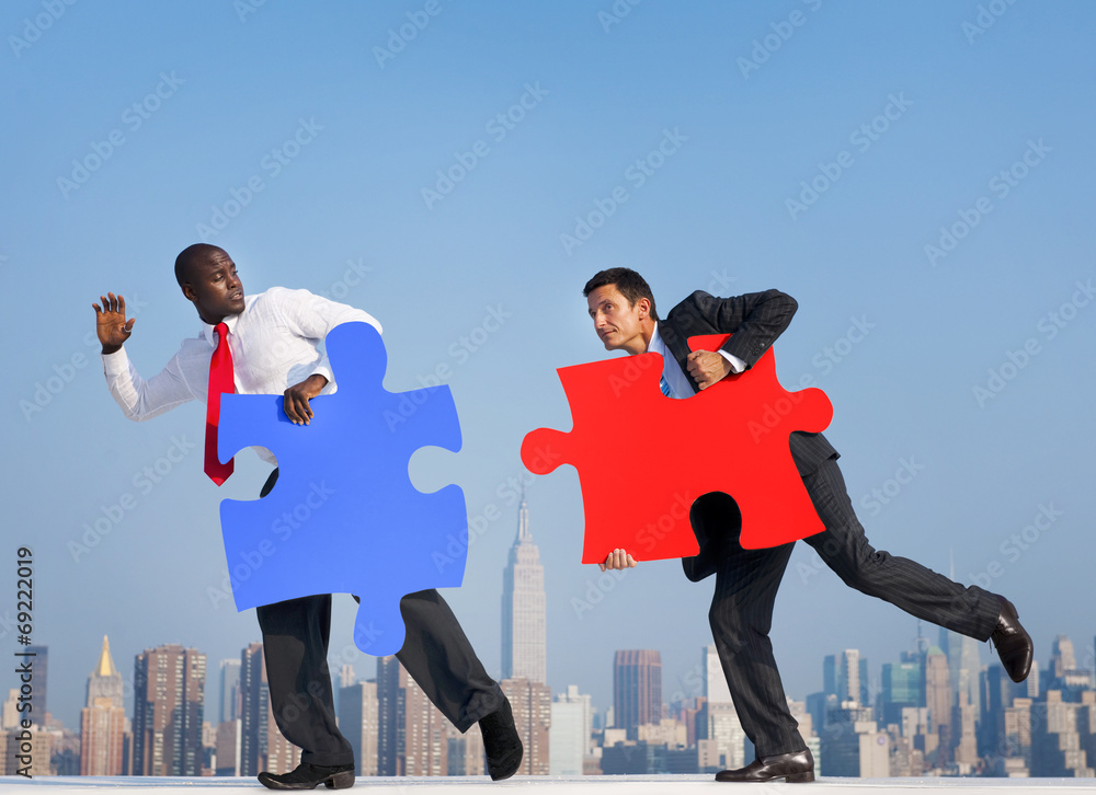 Two Businessmen with Puzzle Piece