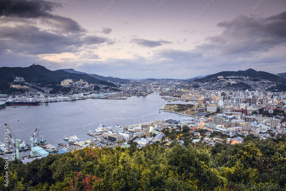 Nagasaki, Japan city skyline at dusk.