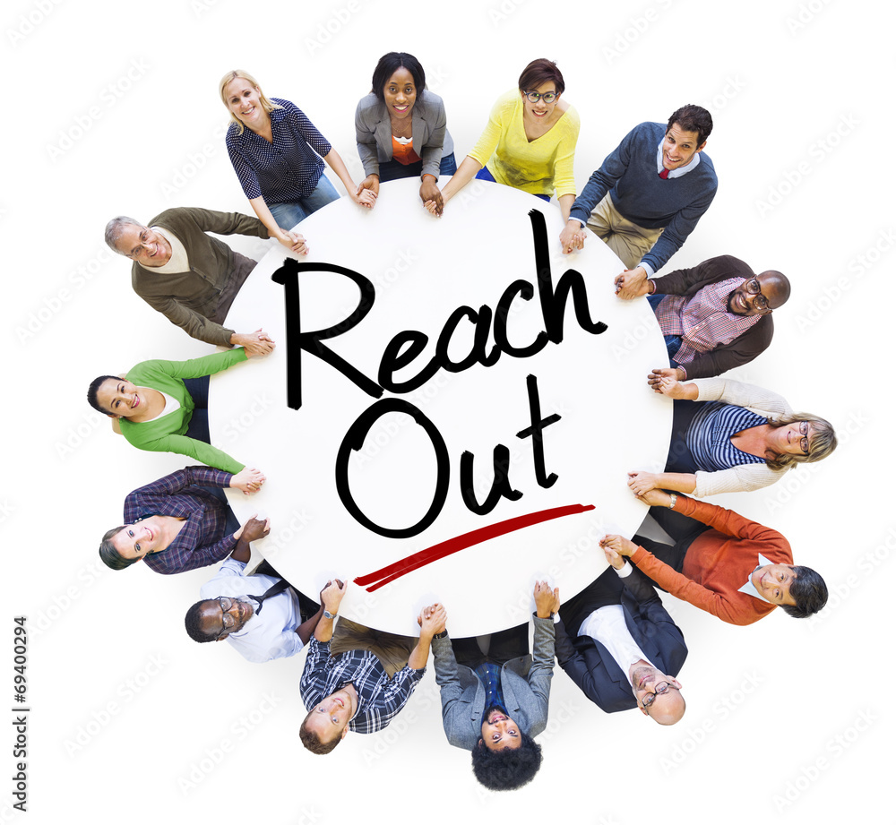 People Holding Hands Around the Word Reach out