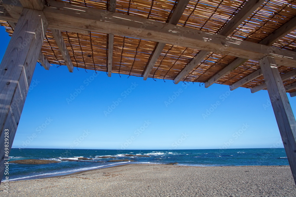 Beautiful blue sea from natural wood hut