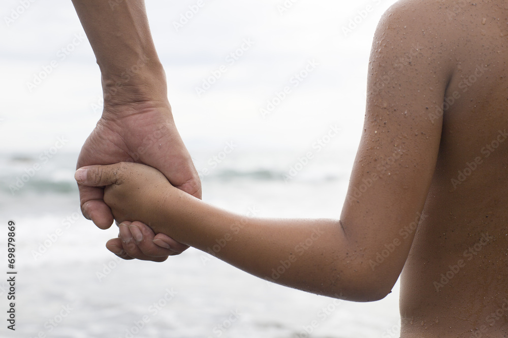 Holding Hands in the father and son