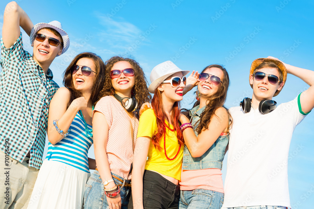 group of young people wearing sunglasses and hat