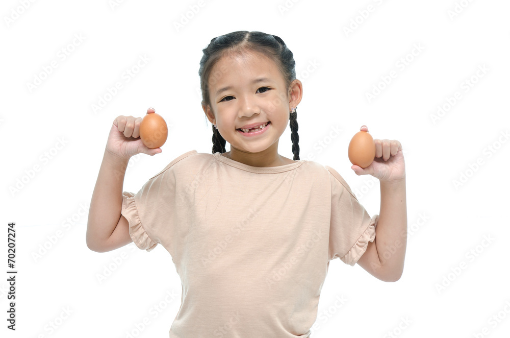 Asian girl smiiing and holding egg