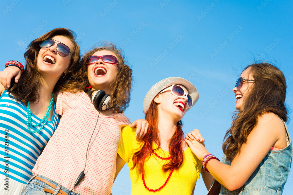 group of young people wearing sunglasses and hat