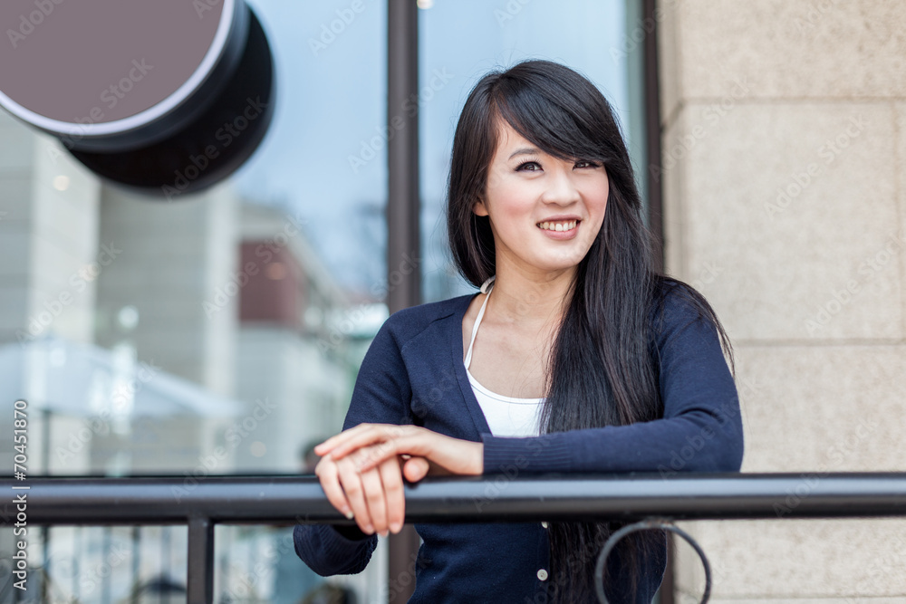 young asian woman at balcony