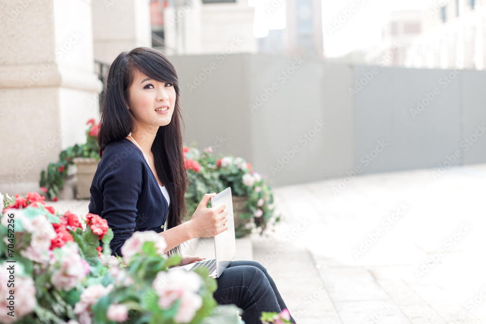 young asian woman with laptop